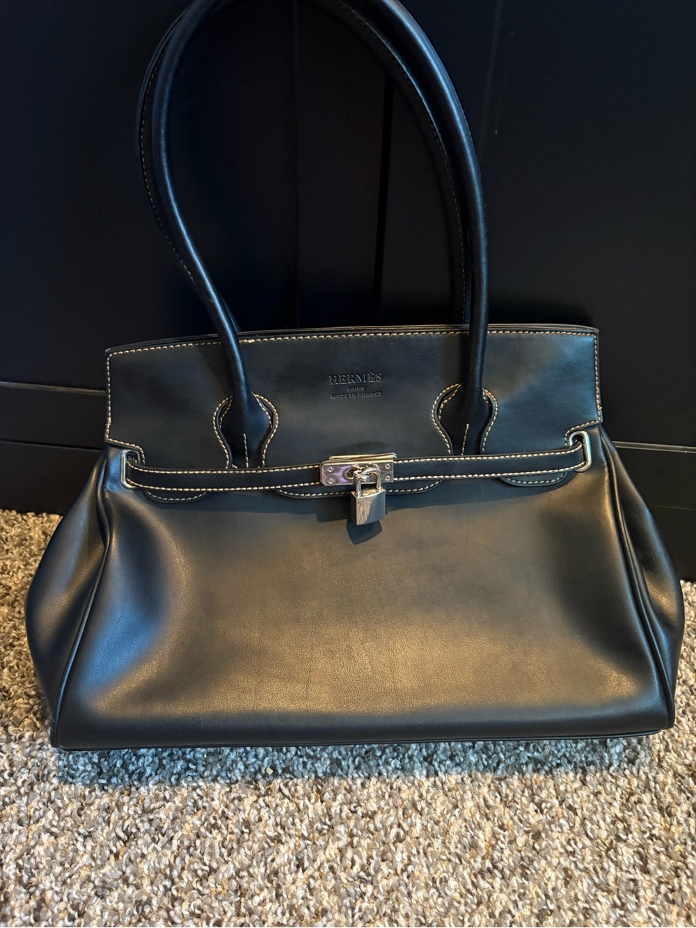 Black leather bag. With lock. Good condition.